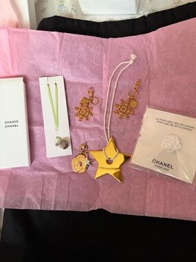 Dior Gold Star Charm, Channel gold Floral Charm and gold snowflakes and more..